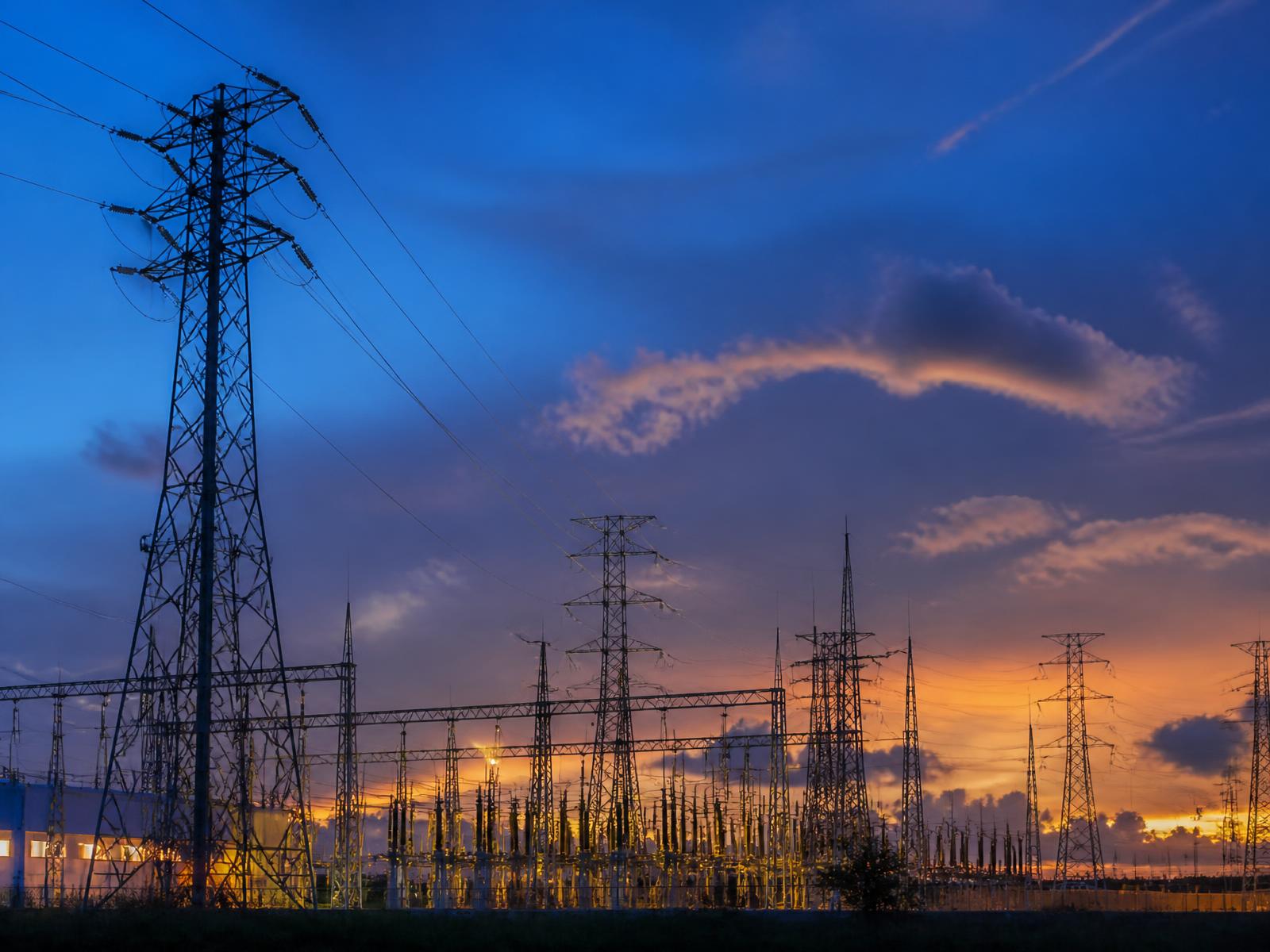 High-voltage transmission substation at dusk
